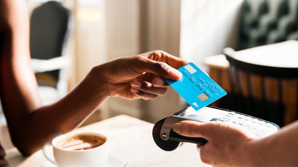 Person paying by card
