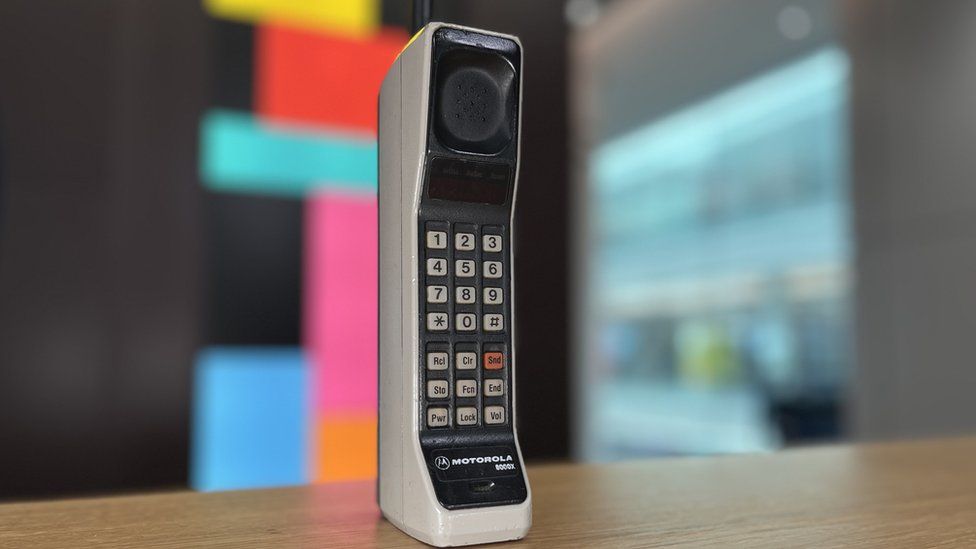 A commercial version of the Motorola phone, first used by Mr Cooper, is owned by the Mobile Phone Museum.