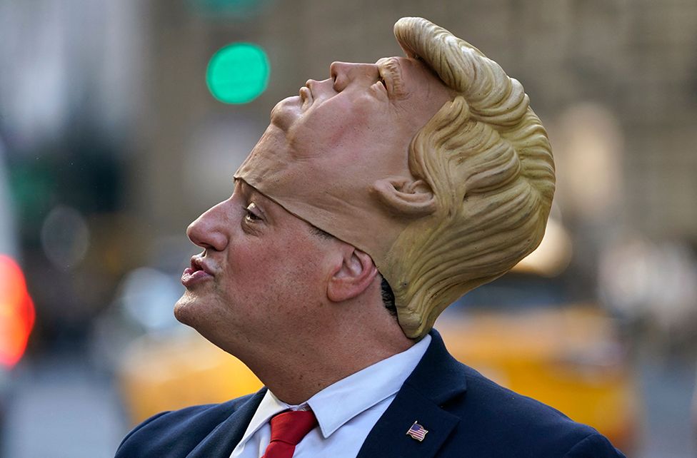Donald Trump impersonator Neil Greenfield waits outside Trump Tower in New York, US, on 12 April 2023