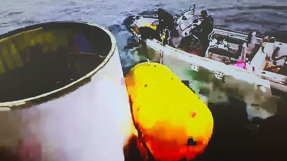 A handout picture shows what is believed to be a part of a space launch vehicle that North Korea said crashed into the sea