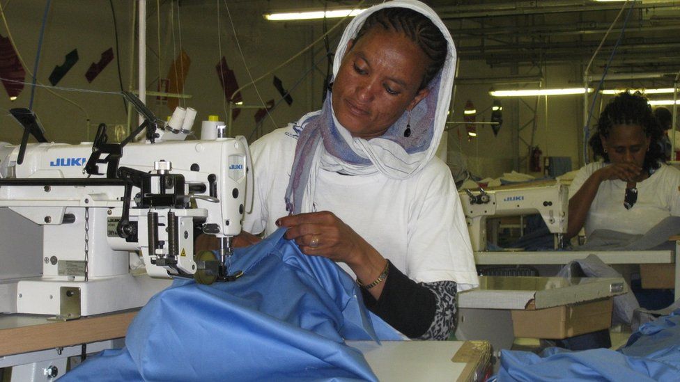 Lady working at the Dolce Vita garment factory