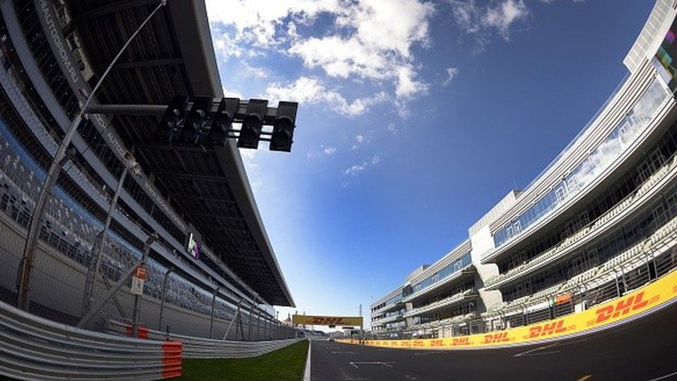 A view of the paddock (R) and a Grand Stand at the F1 Autodrome in Sochi