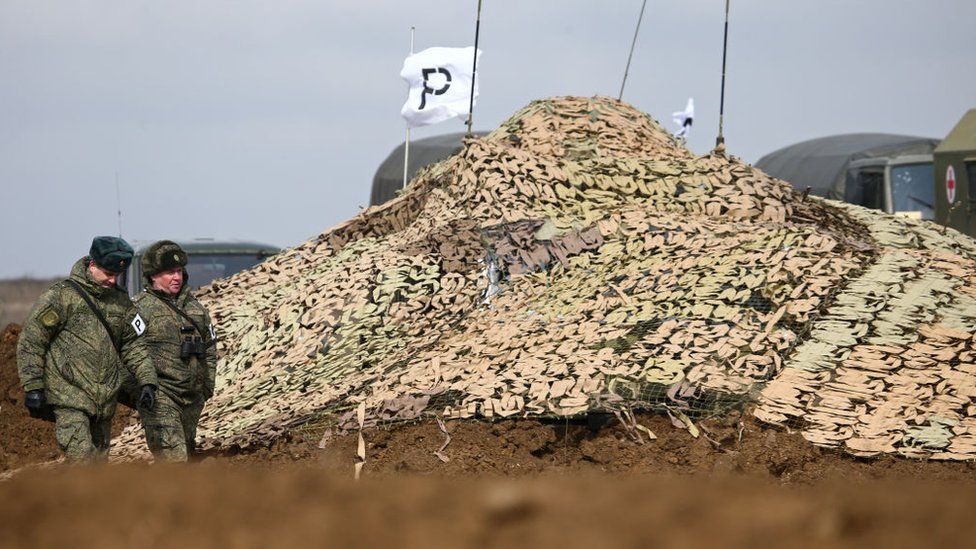 A camouflage net covers military hardware during an exercise held by units of the Novorossiysk guards mountain air assault division of the Russian Airborne Troops at Opuk range