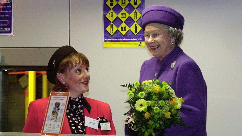 The Queen Laughing With A Ground Stewardess At The Opening Of The New Terminal At Luton Airport. 1999