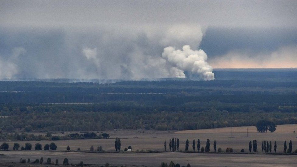 Smoke rises after an explosion at an arms depot in Ukraine