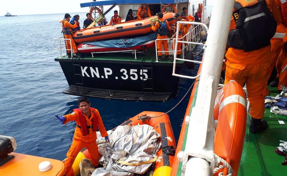 Search and rescue officials in the sea off Jakarta