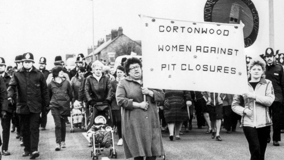 Women march with a Cortonwood Women Against Pit Closures banner