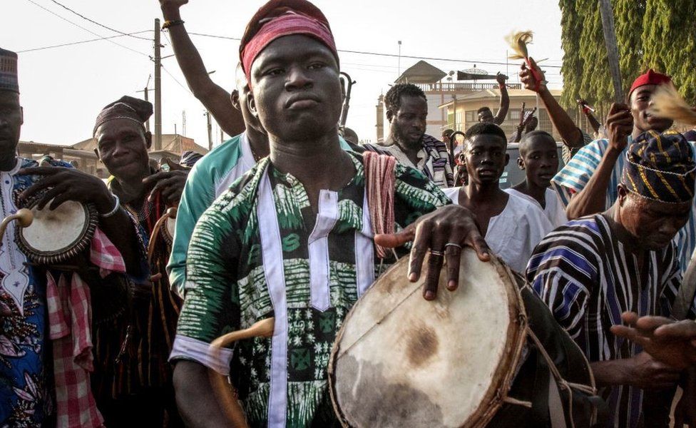 Festival goers perform during a parade in Sokode, Togo, on January 14, 2023 during the celebrations for the Gaani Festival. - The seven centuries old traditions of the Gaani Festival, an annual two-days celebrations of joy and victory, are held in Togo, Benin and Nigeria