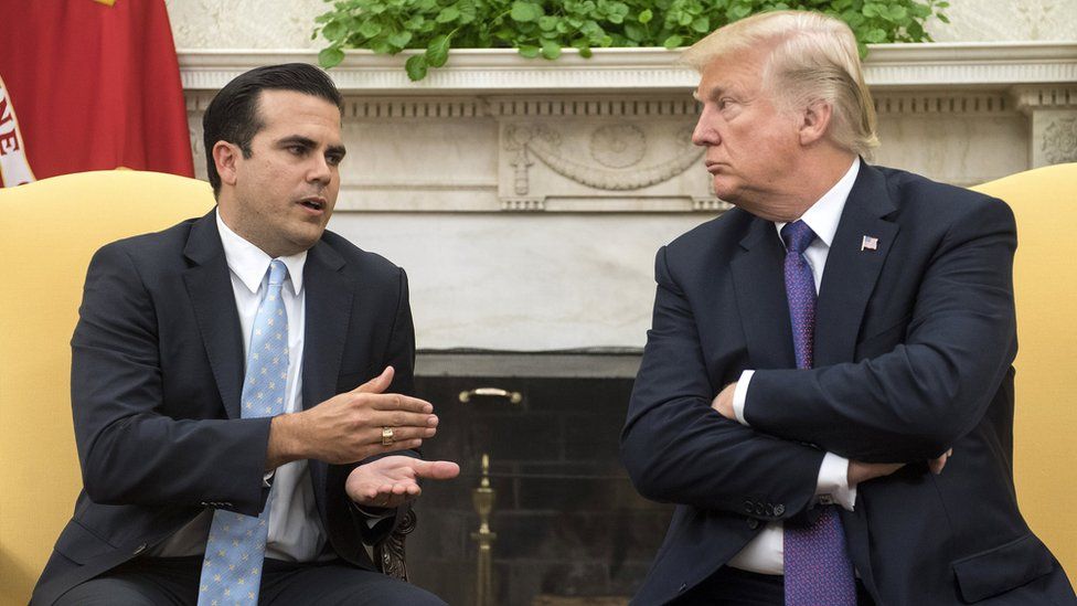 Ricardo Rossello and Donald Trump sitting and talking