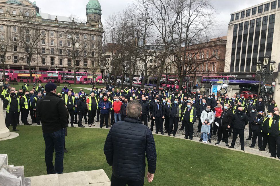 Bus drivers hold a protest in support for a colleague whose bus was hijacked and burnt in west Belfast