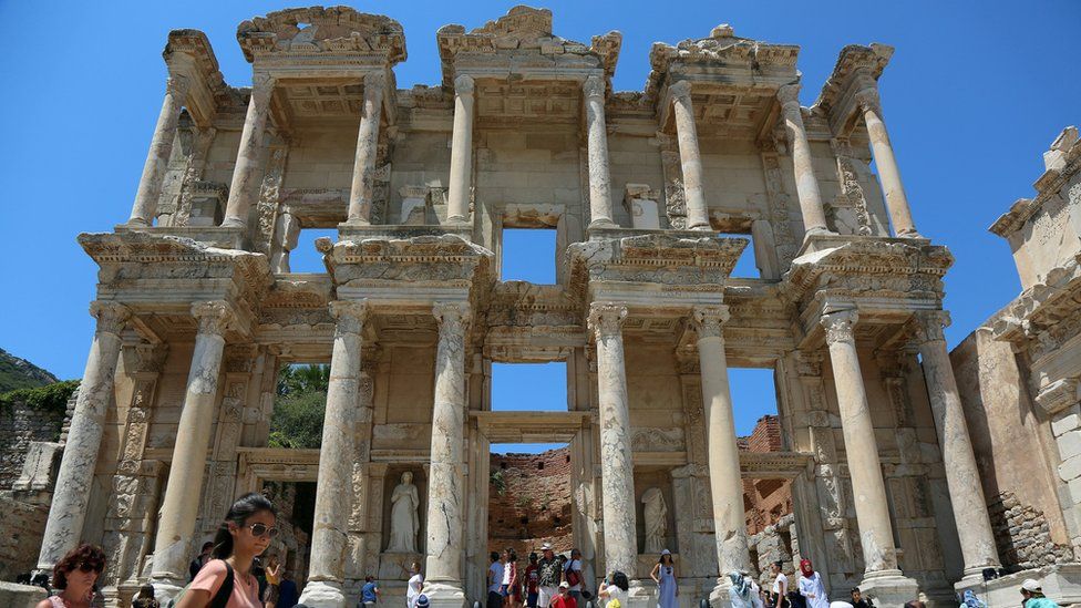 Tourists visit the Celsius Library in the ancient city of Ephesus near Izmir in the western Aegean region, Turkey