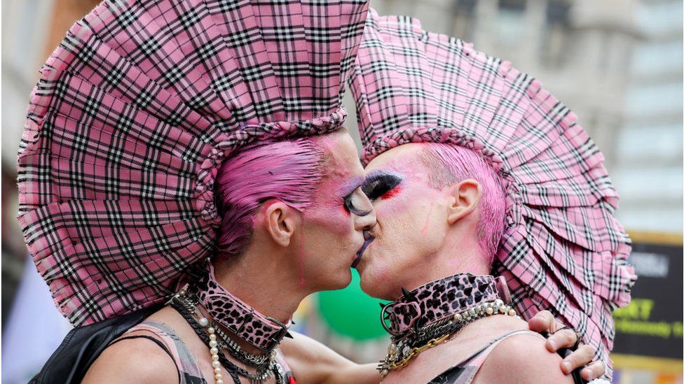 Parade goers share a kiss during Pride in London 2019 on July 06, 2019 in London