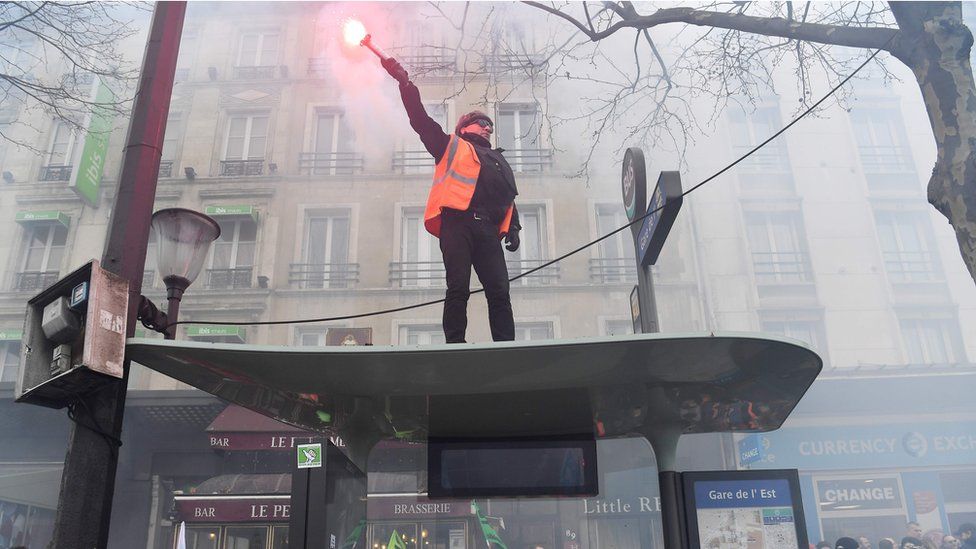 A man with a flare in Paris