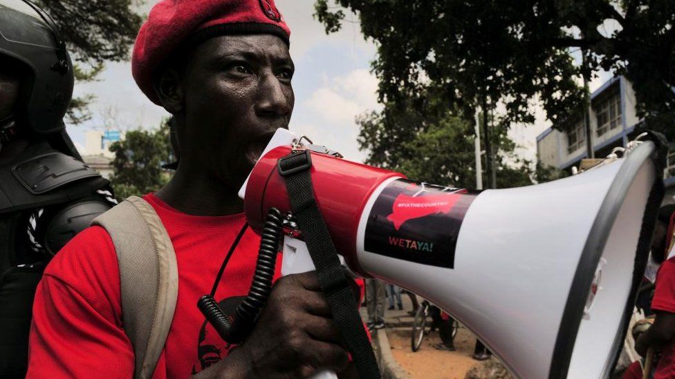 A protester speaks while Ghanaians march in the streets to protest the worsening economic crisis and to call on the president to step down, in Accra, Ghana November 5, 2022