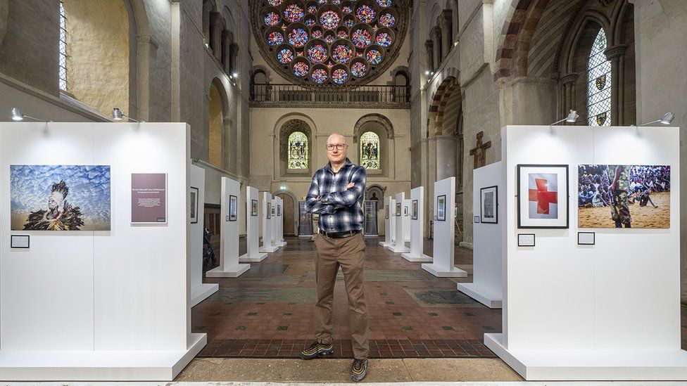 Jonathan Banks with his exhibition in St Albans Cathedral