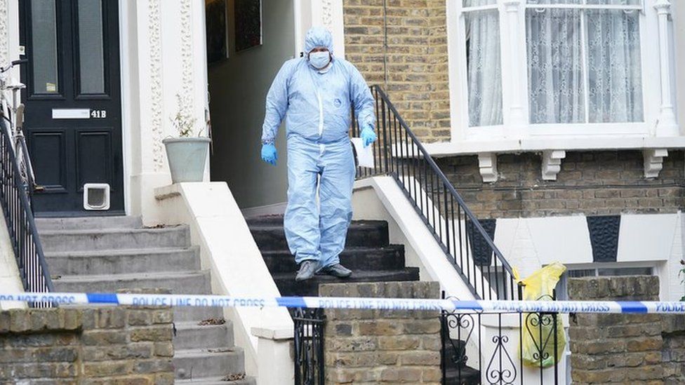 Forensic officers at a property on Montague Road in Dalston, Hackney, east London