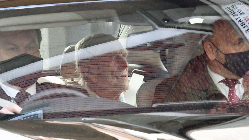 The Duke of Edinburgh is driven away in a car after leaving the King Edward VII"s Hospital, London