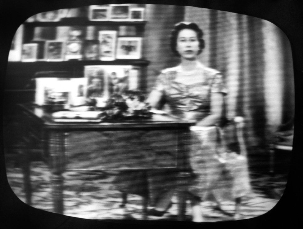 The Queen seen on a television screen as she concludes what became her traditional Christmas day broadcast to her people, which was televised in 1957 for the first time and carried by both the BBC and ITV.