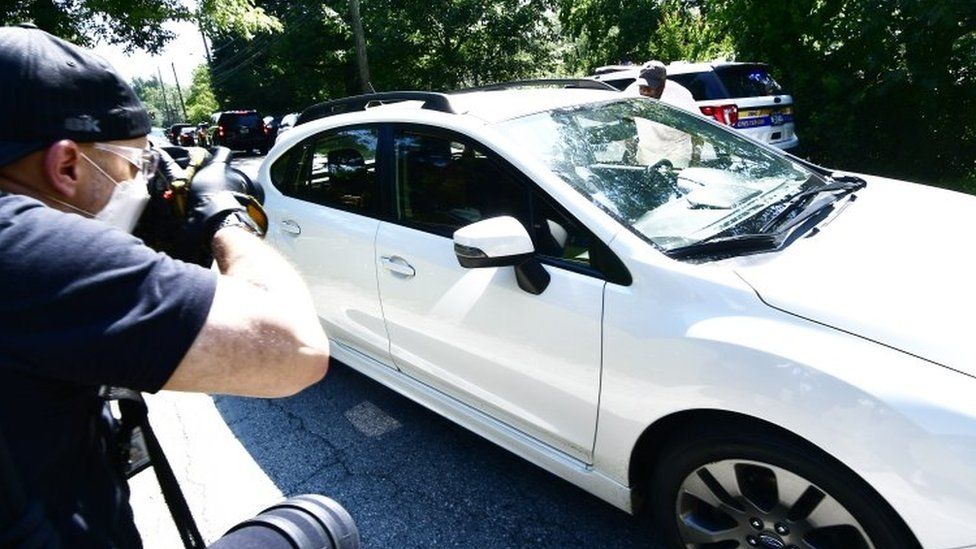 A car carrying US actor Bill Cosby in the front passenger seat arrives home after the Pennsylvania Supreme Court