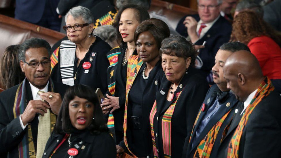 Members of Congress wear black clothing and Kente cloth in protest before the State of the Union address in the chamber of the U.S. House of Representatives January 30, 2018