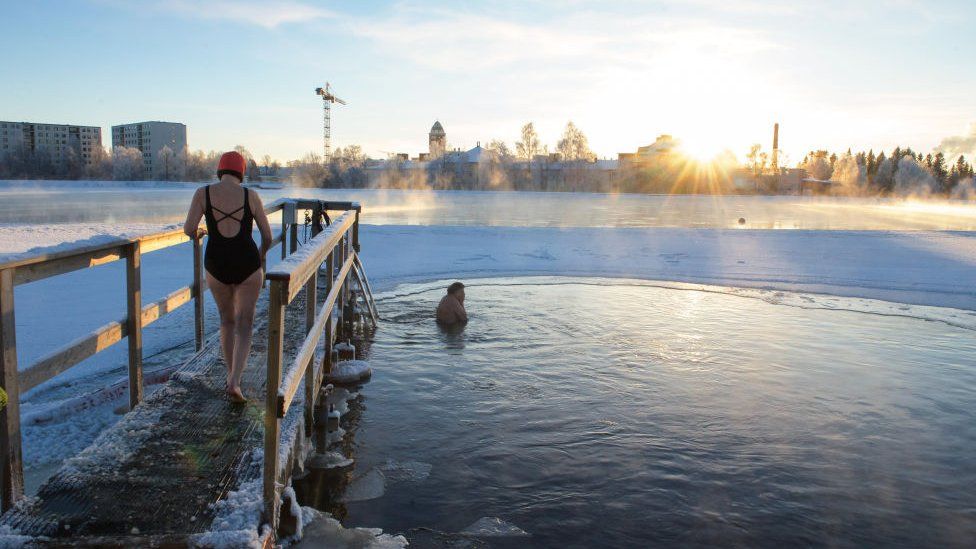 A frigid swim in the river in below zero temperatures in Finland