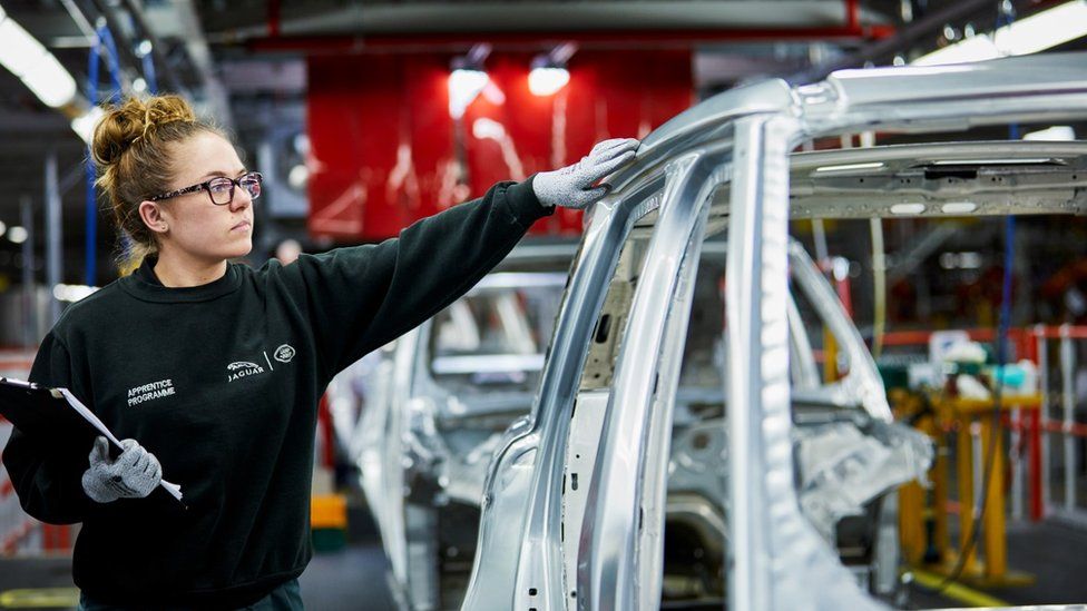 Car worker in factory