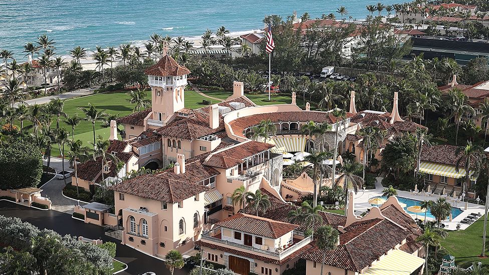 An aerial view of Mar-a-Lago with trees and gardens in the background next to the ocean, taken in 2018.