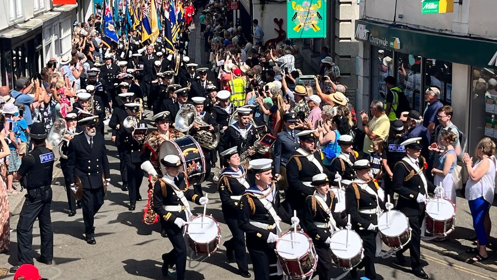 A band leads the parade through the town