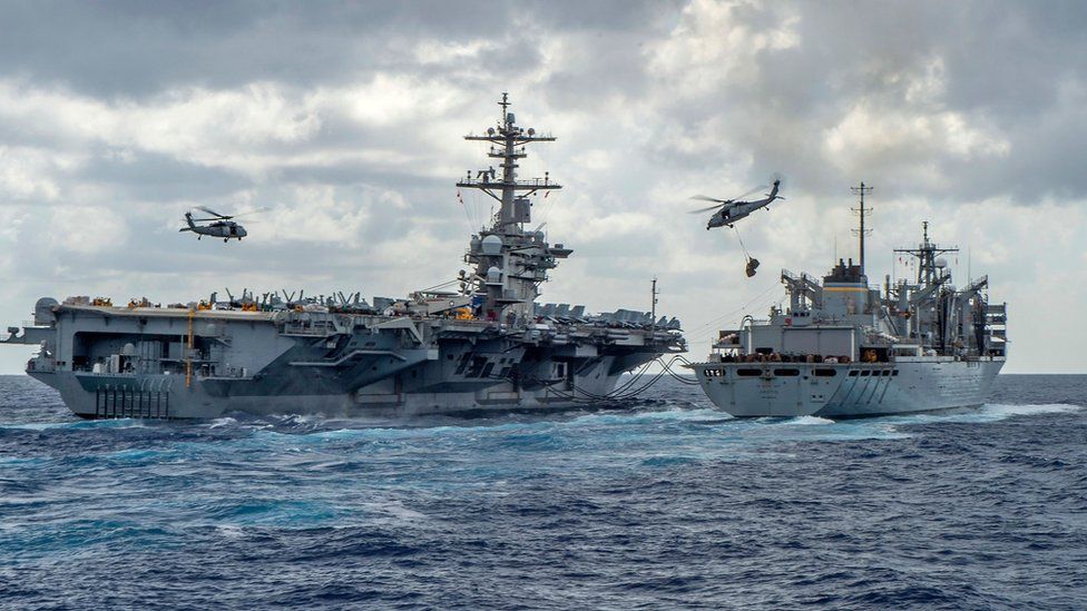 Handout picture released by the US Navy on 8 May 2019 shows the Nimitz-class aircraft carrier USS Abraham Lincoln being replenished at sea by the fast combat support ship USNS Arctic (T-AOE 9)