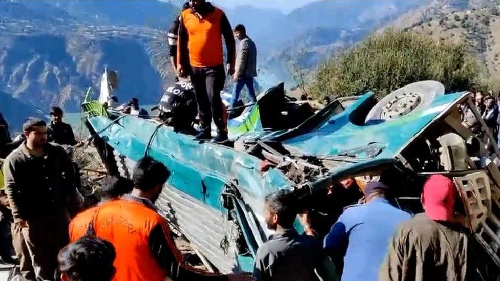 The mangled remains of the bus which fell into a gorge in Jammu