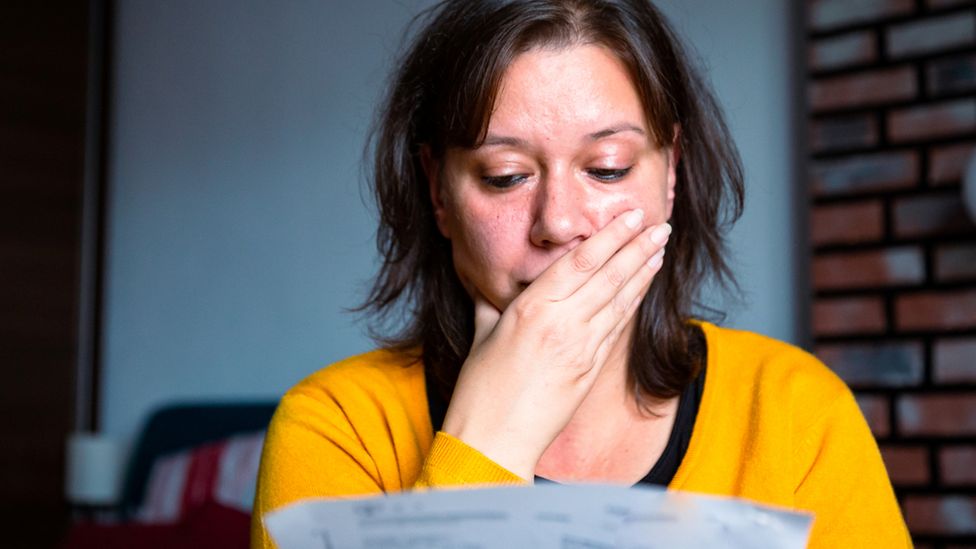 Woman reads bill