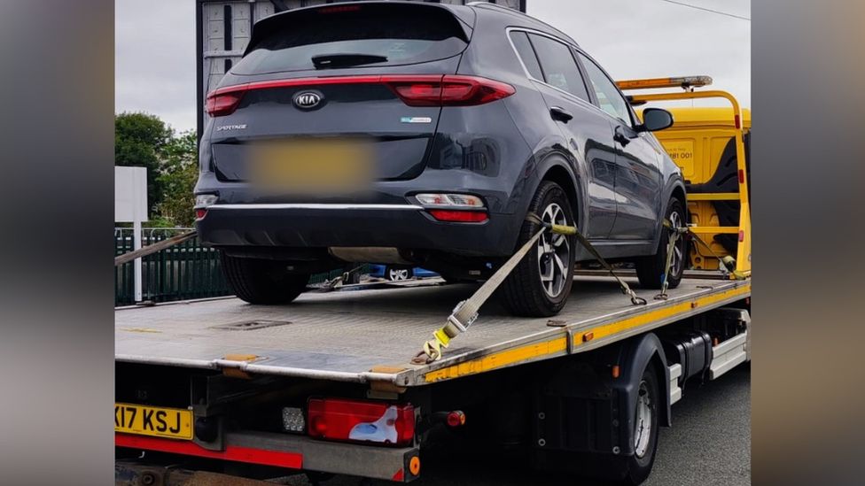 Car on recovery lorry