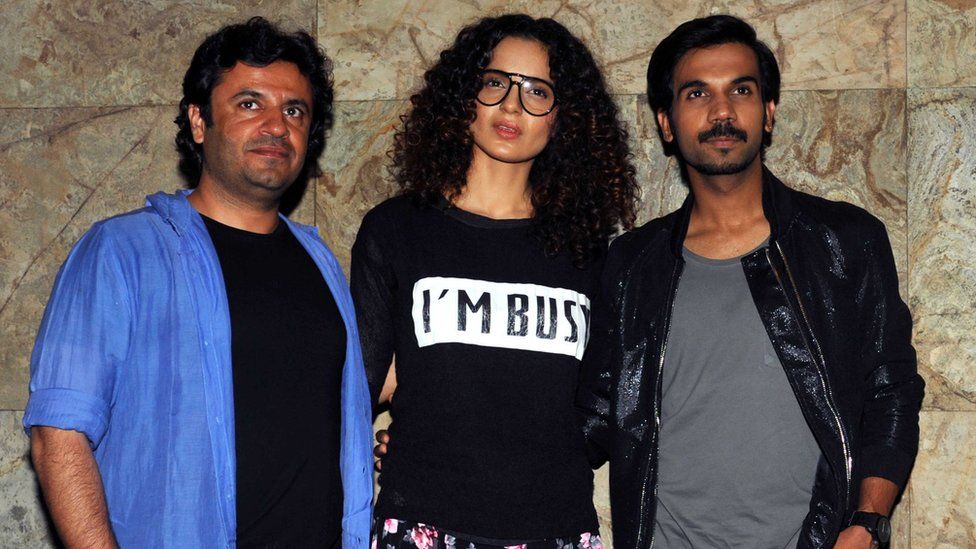 Indian Bollywood personalities (L-R) Vikas Bahl, Kangana Ranaut and Rajkummar Rao attend a special screening for the upcoming Hindi film 'Queen' in Mumbai on February 28, 2014.