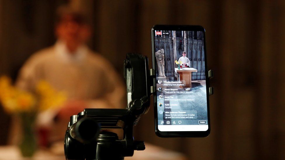 Very reverend Andrew Tremlett, conducts Sunday holy communion live on social media in shrine of St Cuthbert as the spread of the coronavirus disease (COVID-19) continues. Durham,