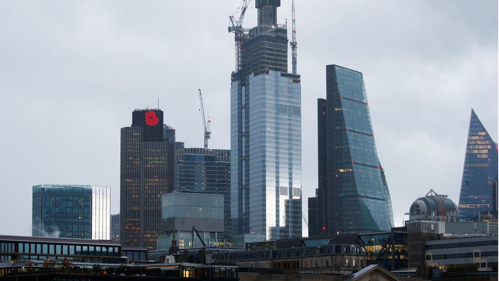 A commemorative poppy can be seen atop Tower 42 in the city of London,