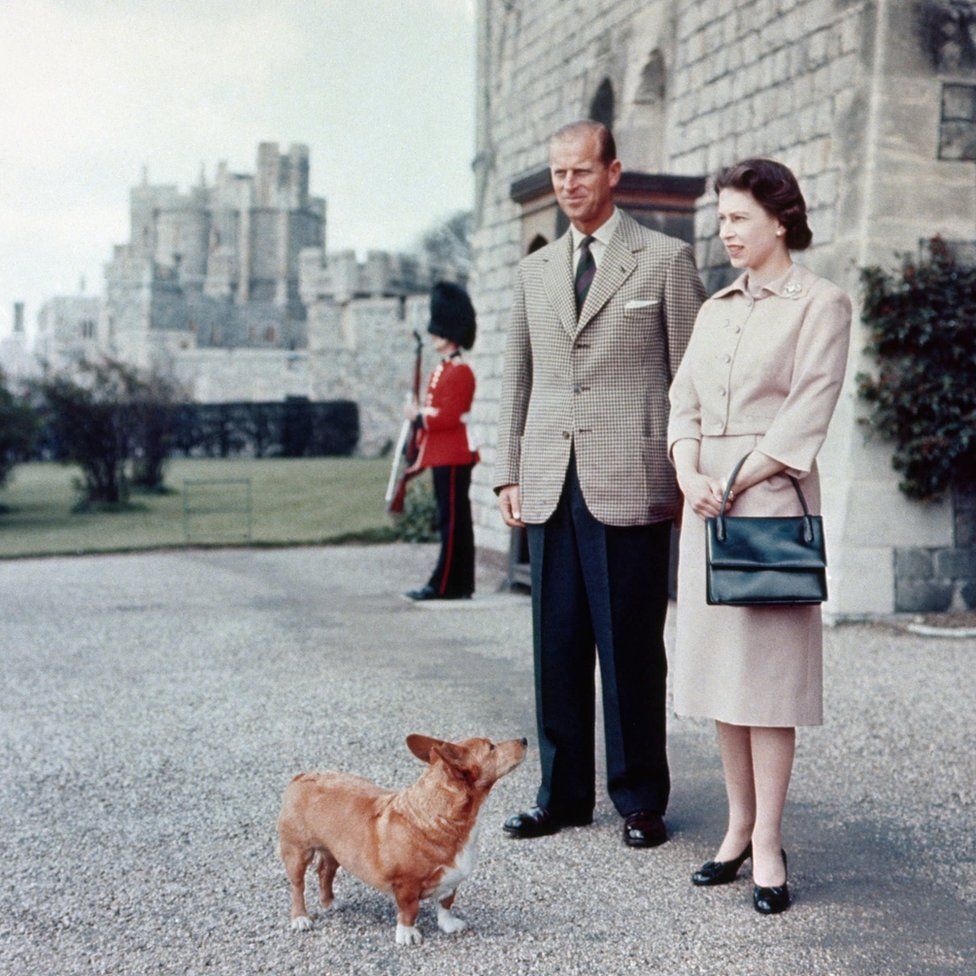 Queen Elizabeth II and Duke of Edinburgh at Windsor joined by Sugar, one of the Royal corgis