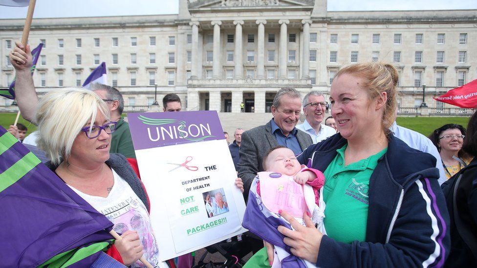 Members of the Unison trade union protest at Stormont against proposed health service cuts