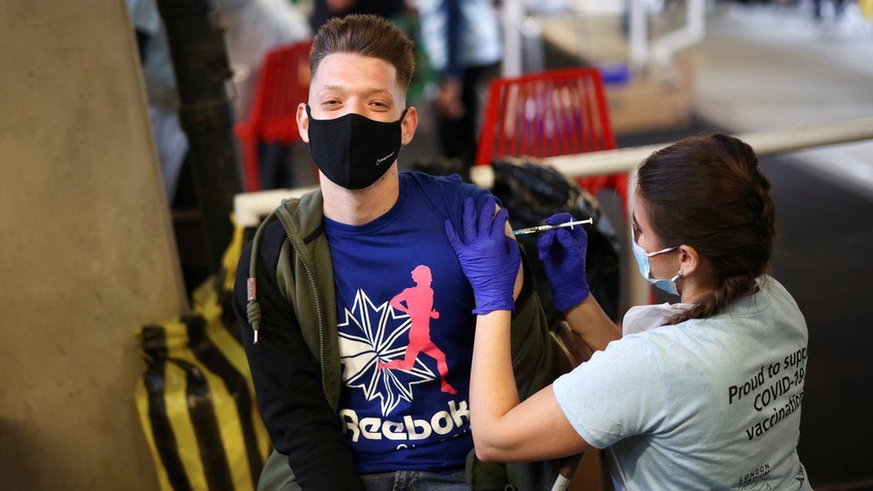 A man receives a Pfizer vaccine at a mass vaccination centre for those aged 18 and over in London last weekend