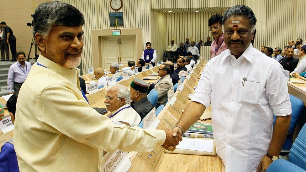 India Andhra Pradesh Chief Minister Chandrababu Naidu (L) shakes hands with Tamilnadu Chief Minister O Panneerselvam during the Joint Conference of Chief Ministers and Chief Justices of High Courts in New Delhi on 5 April, 2015