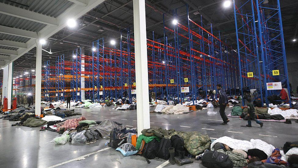 A logistics centre where migrants are being temporarily housed