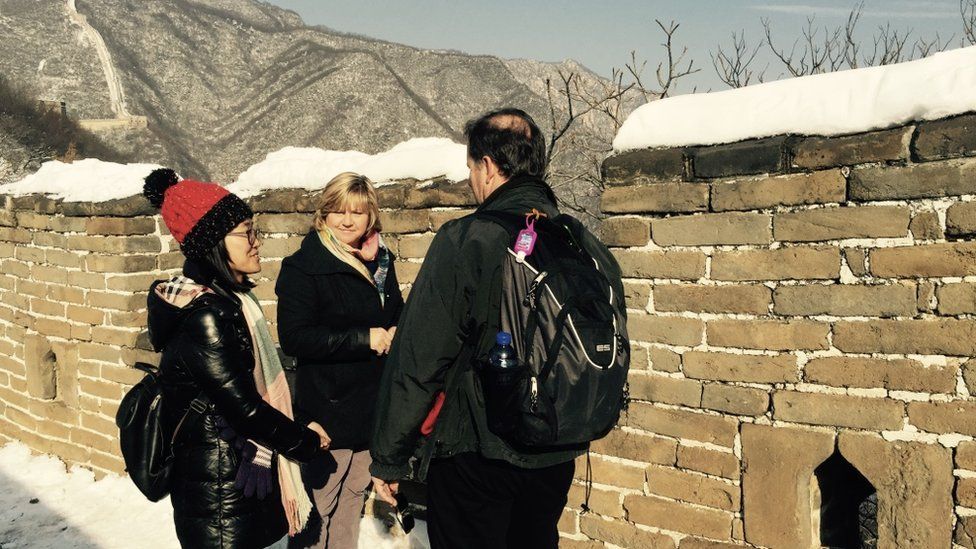 Chinese tour guide Catherine Lu taking people around the Great Wall of China