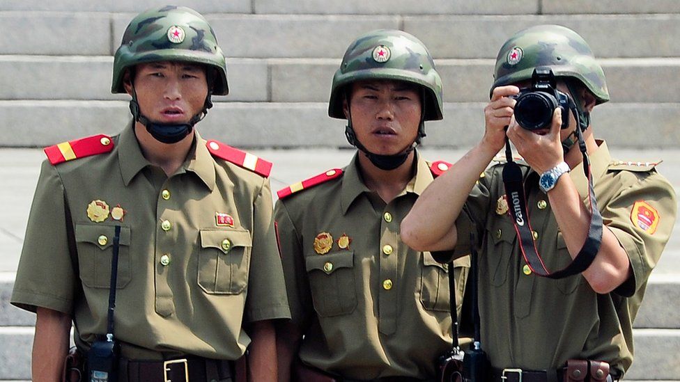 North Korean soldiers look at the South side during a ceremony marking the 61th anniversary of the signing of the armistice agreement on July 27, 2014 in Panmunjom, South Korea