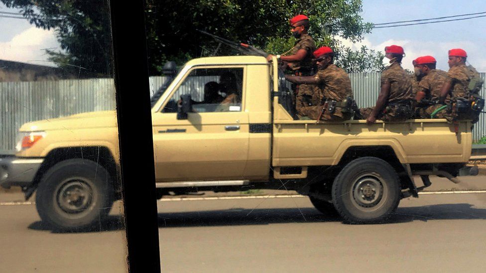 Ethiopian soldiers ride on their pick-up truck as they patrol the streets following protests in Addis Ababa - July 2020
