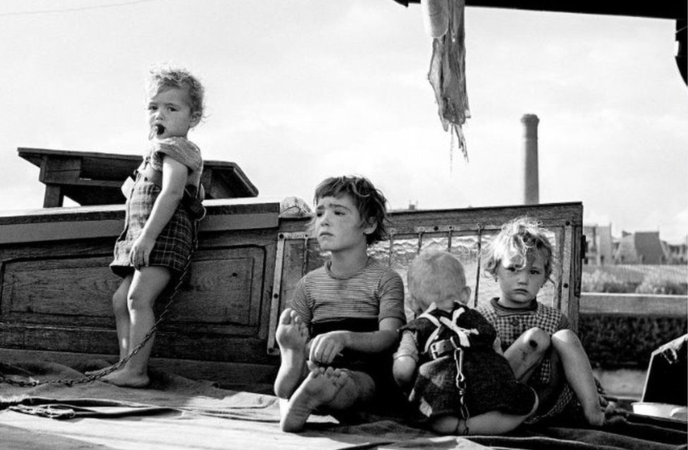 Children shackled on a barge in Paris, 1953