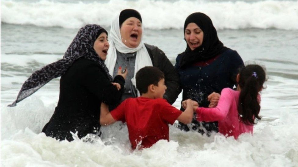 Police escort for Syrian refugee Benone beach trip - BBC News