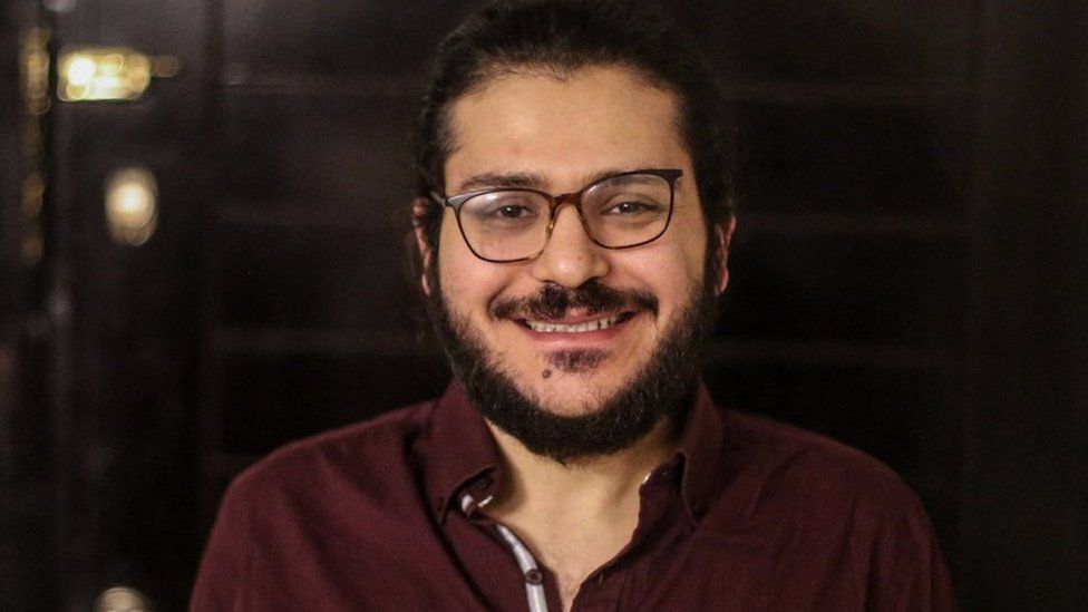 File photo showing Patrick Zaki in Cairo after a court ordered his provisional release (7 December 2021)