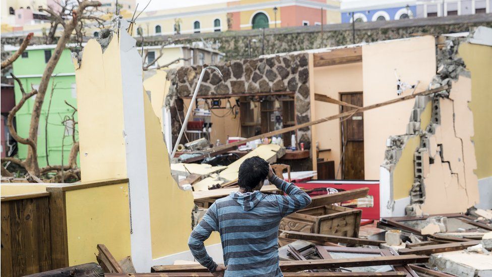 Image shows damaged homes after Hurricane Maria made landfall on 21 September 2017 in San Juan, Puerto Rico