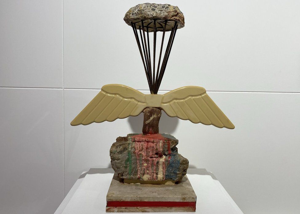 Sculpture of paratrooper made from building materials