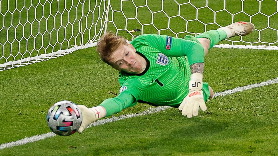 England's goalkeeper Jordan Pickford saves a penalty during the Euro 2020 final between Italy and England on 11 July 2021