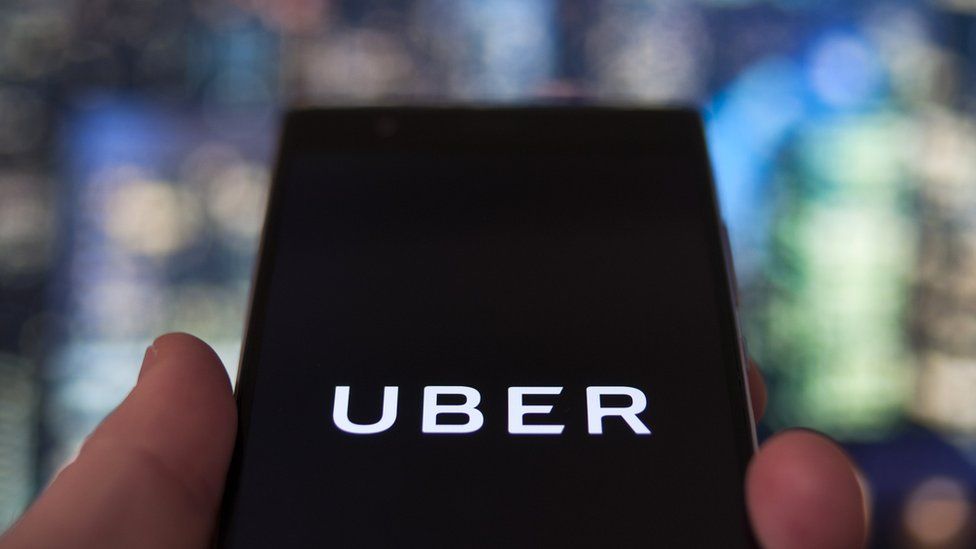 The Uber taxi-hailing app appears on a mobile phone screen, 12 February 2018